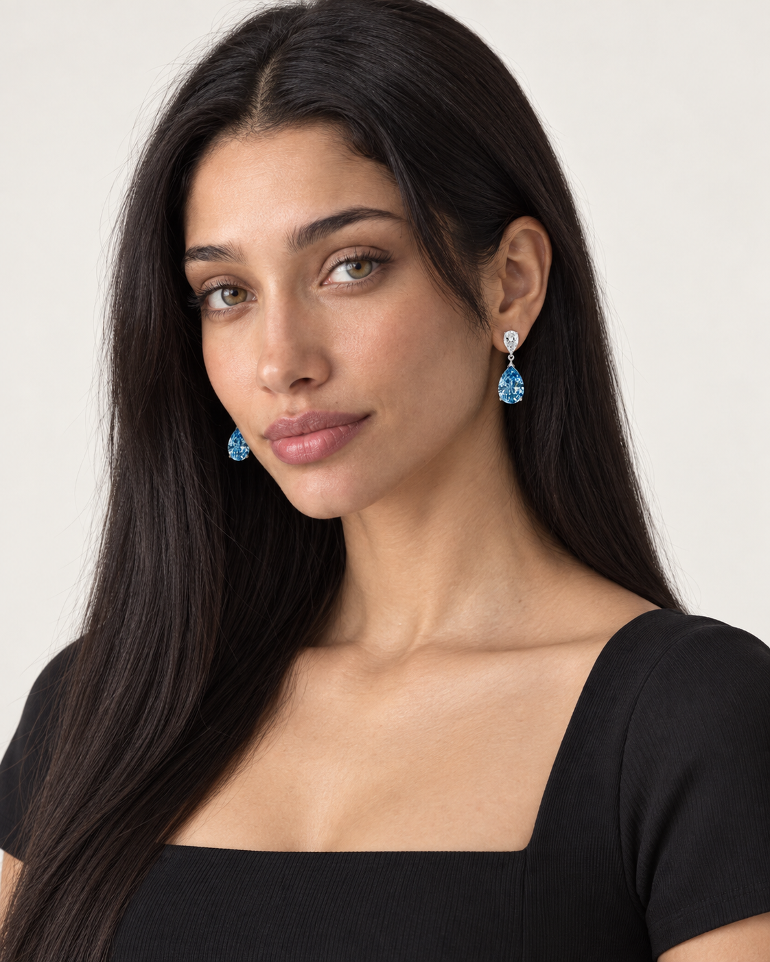 Blue Pear Drop Earrings — worn studio view