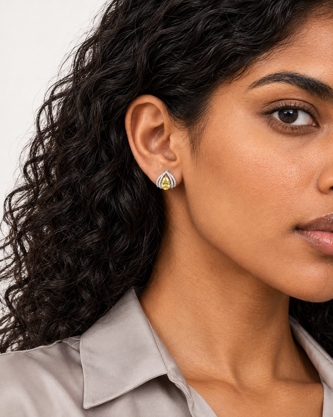 Yellow Pear Halo Studs — worn close view