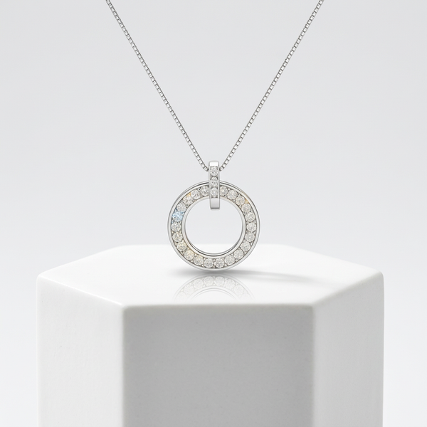 Sterling silver diamond pendant on a 16 inch chain, sitting at the base of the throat as a necklace chain length reference