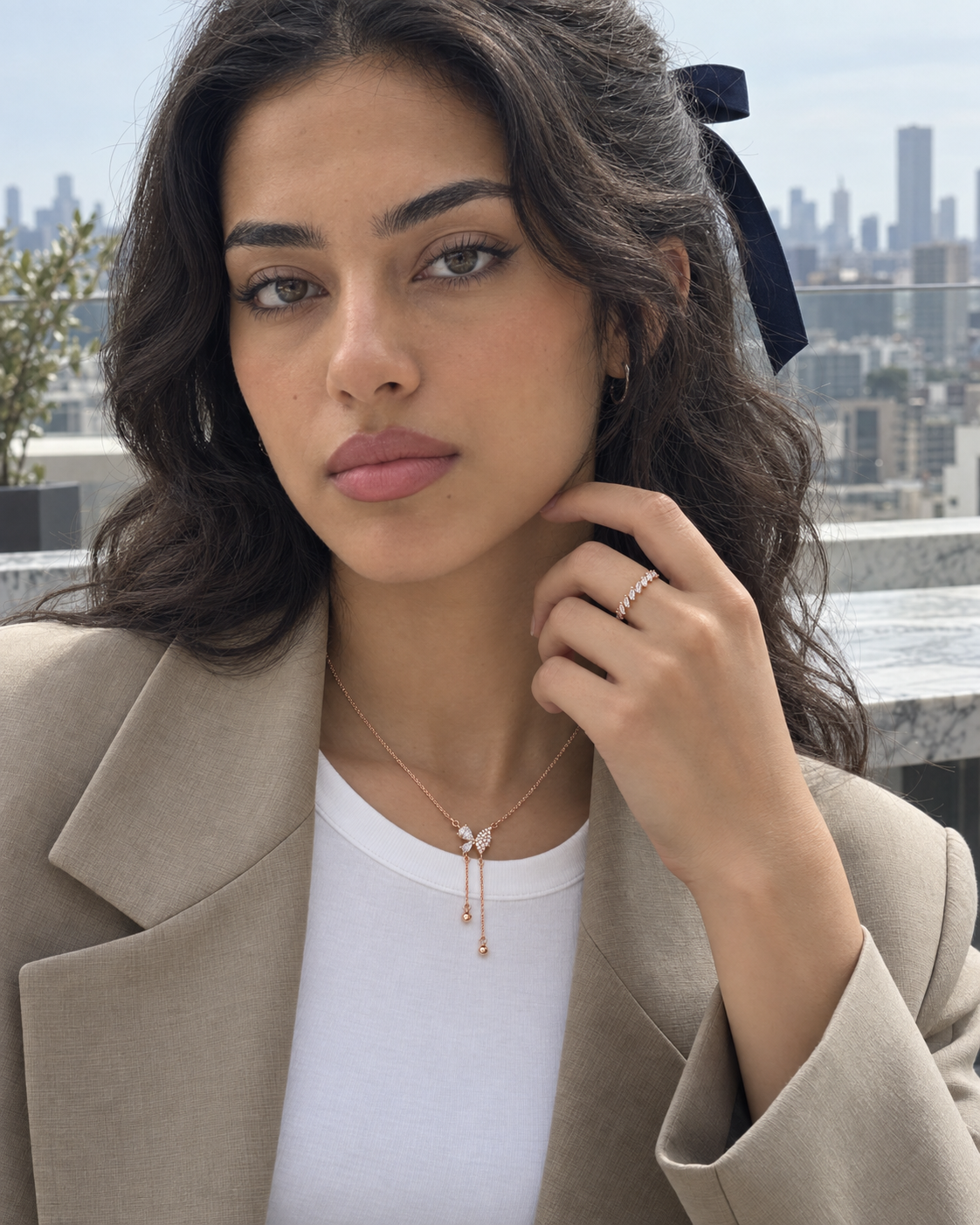 New In collection: Butterfly Tassel Necklace, Angled Baguette Ring worn by a model