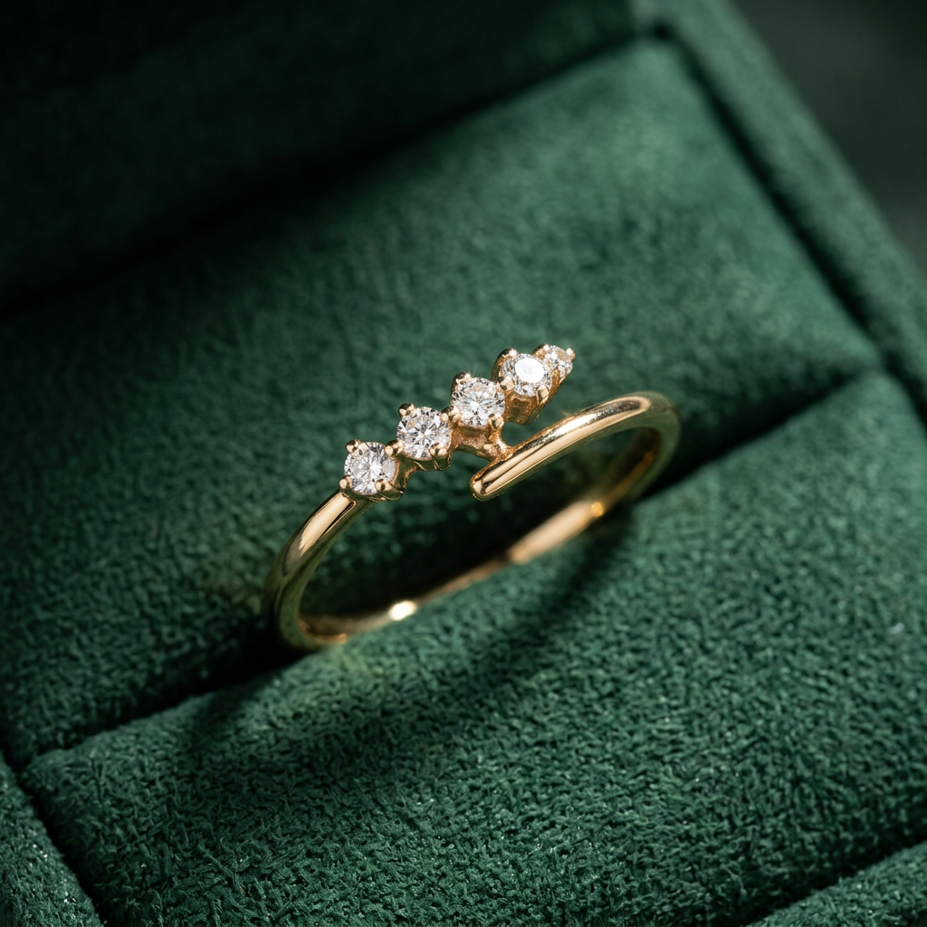 Fluid rose gold open ring featuring a high-polish bypass silhouette accented by four graduated round diamonds.
