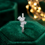 An exquisitely crafted statement piece featuring a striking a symmetrical butterfly motif, beautifully adorned with brilliant light-reflecting pear and round cut lab grown diamonds.