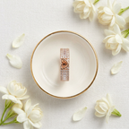 Macro photo focusing on the precise crisp baguette stones and shimmering pavé borders framing a rose gold heart.