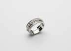 A luxury multi-band hand stack anchoring a triple layer sterling silver layered ring with slim modern silver jewelry.