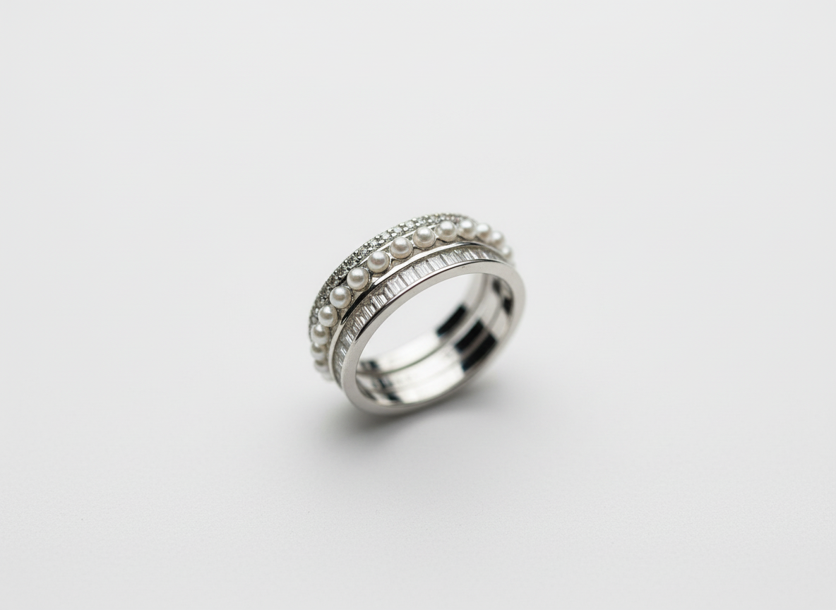 A luxury multi-band hand stack anchoring a triple layer sterling silver layered ring with slim modern silver jewelry.