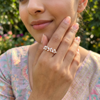 A model wearing the delicate rose gold butterfly ring on her index finger, showcasing its modern romantic aesthetic.