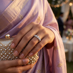 Macro photo focusing on the precise pear cut stones nestled within the sculptural frame of a silver chevron ring.