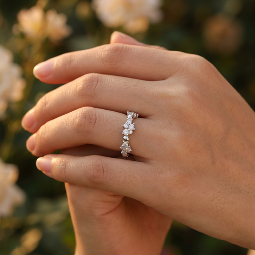 Close-up of a model wearing a fine sculptural crystal cluster ring with an asymmetric modern constellation look.