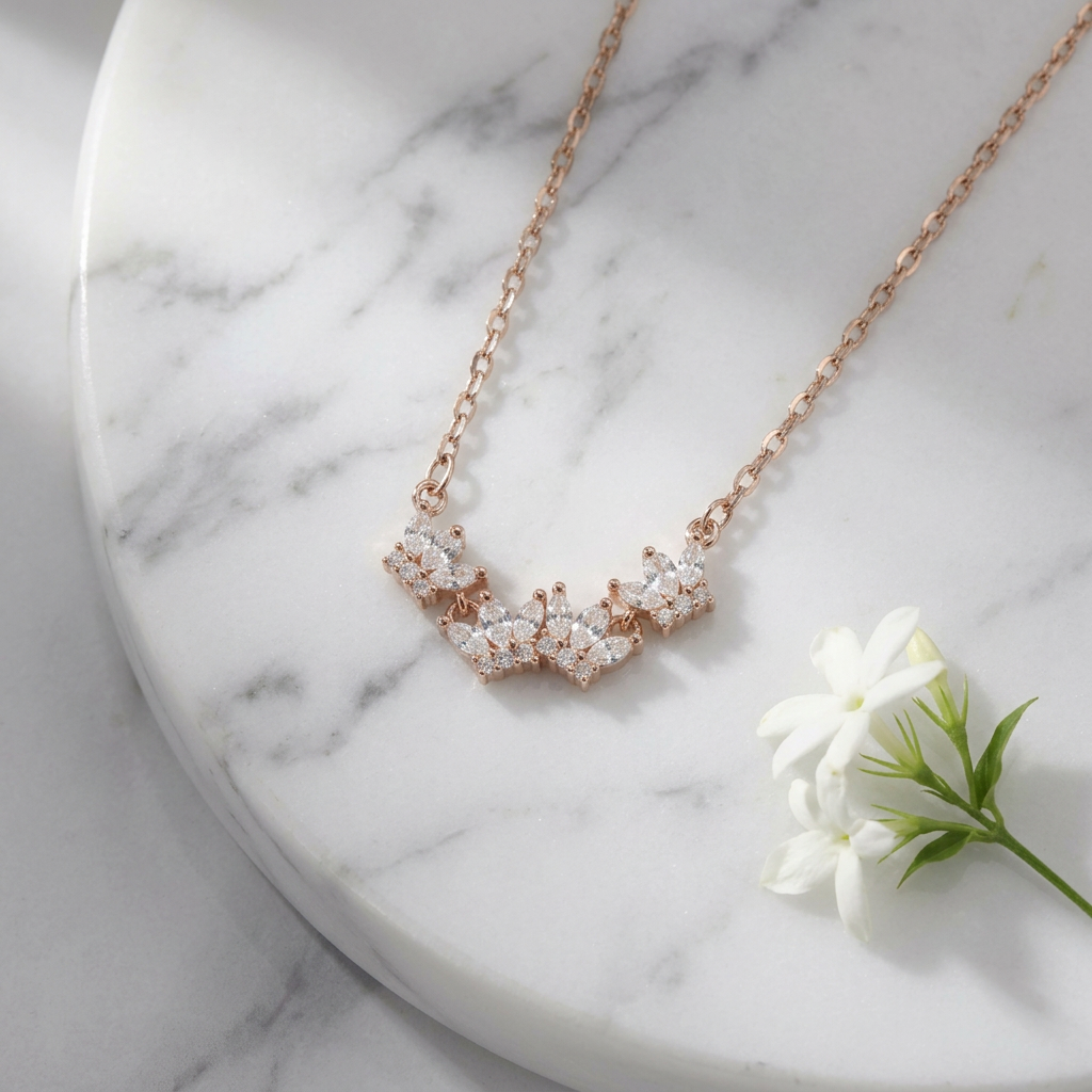 A fanned arc of marquise and brilliant-cut stones on a polished gold cable chain tiara necklace for women.