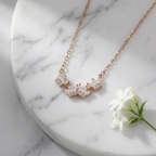 A fanned arc of marquise and brilliant-cut stones on a polished gold cable chain tiara necklace for women.