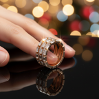 A lifestyle close-up showing the stunning elegance of a multi-row statement ring, beautifully catching the light with its brilliant step cut and pavé-set lab grown diamonds.