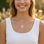 A woman styling the Infinite Medallion necklace for an elegant everyday wear look, showcasing the geometric architectural pendant with radiant lab grown diamond settings.