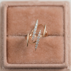 A straight-on front view of an architectural thorn ring showcasing the symmetrical geometric lines and precise pave settings of brilliant lab grown diamonds.