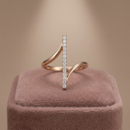 Front view displaying the inner open spaces and tilted alignment of an orbital spinning gold axis ring.