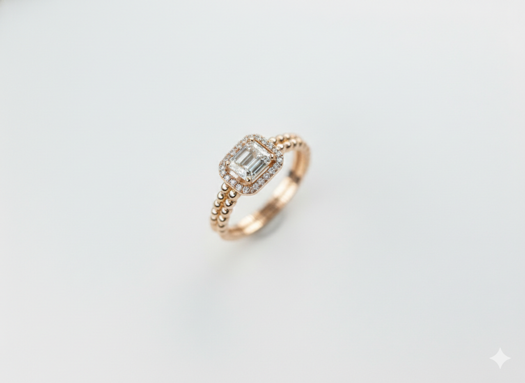 Symmetrical overhead view of a flawless E-F color VVS clarity lab grown diamond emerald cut halo ring.