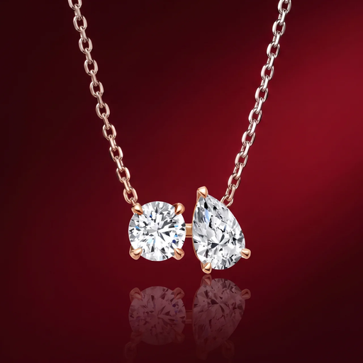 Lab-grown diamond pendant necklace in rose gold by House of Raayaa — toi et moi round and pear motif.