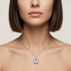 Women wearing the Infinite Medallion pendant necklace showcasing the fine architectural geometry, sharp baguette-cut stones, and pave-set lab grown diamonds.