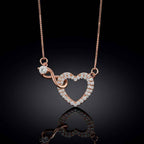 Studio presentation highlighting the seamless interlocking loop of a rose gold infinity heart pendant.