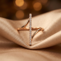 A yellow gold structural ring with a central geometric axis band that pivots smoothly within an outer frame.