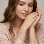 A modern multi-layered jewelry look highlighting a fine pearl double chain as a luminous stack base.