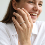 Designer geometric diamond band styled on a finger, featuring a sharp zig-zag silhouette.