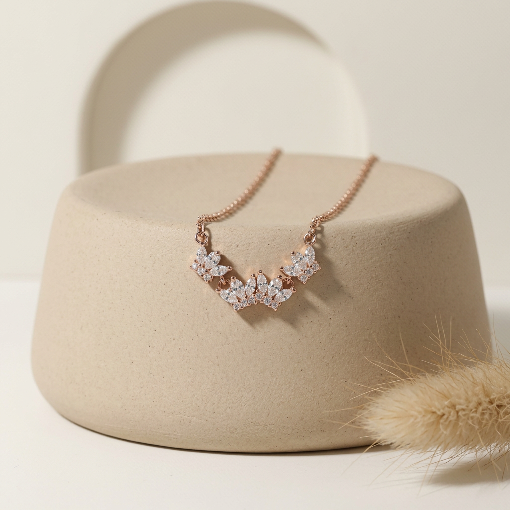 A regal gold arc necklace crafted with a fanned tiara motif resting on a minimalist surface for a clean e-commerce view.