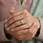 Front view of a sterling silver round ring featuring a dense pavé cluster and modern graduated bezel settings.