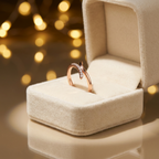 A sculptural rose gold open modern ring nestled inside a premium, elegant velvet jewelry gift box.