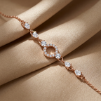 Extreme close-up of a luxury rose gold pavé bracelet showcasing a central halo and symmetric pear cut stones.