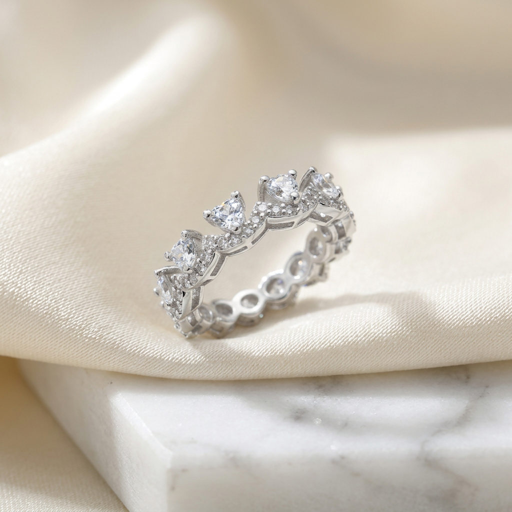 Front view of a sterling silver chevron ring featuring a series of sharp pear cut stones in a high polish frame.