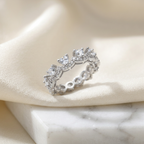 Front view of a sterling silver chevron ring featuring a series of sharp pear cut stones in a high polish frame.