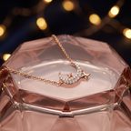 Detailed macro shot of a rose gold crescent moon pendant sparkling with a fine, brilliant-cut pavé stone setting.