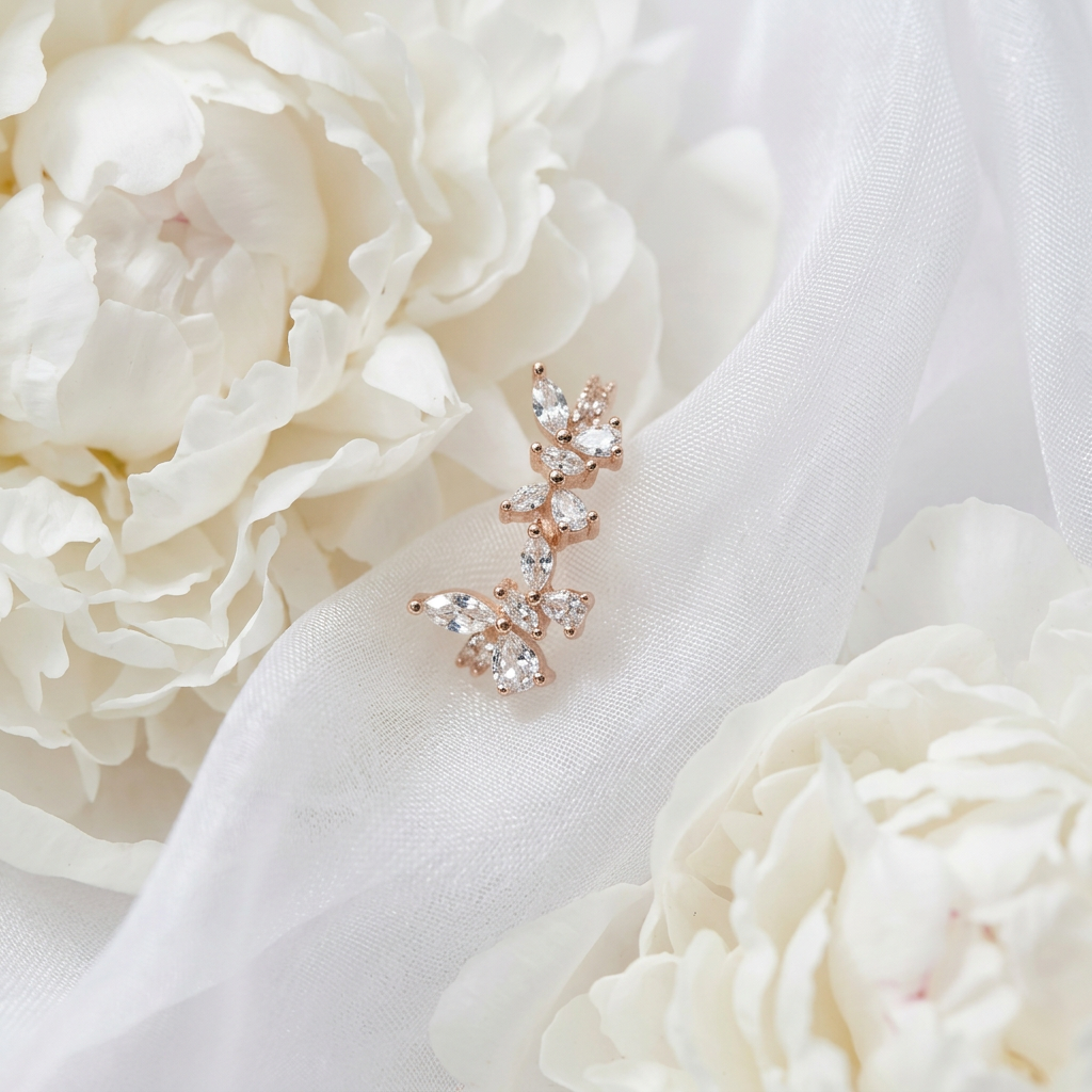 Macro shot zooming in on eye-shaped marquise stones set in delicate leaf-shaped gold prongs.