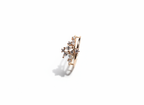 Studio flat lay of a geometric diamond cluster band in polished gold isolated cleanly on a warm marble plate.