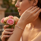 A model wearing the dainty diamond ribbon bracelet, illustrating its elegant drape on the wrist.