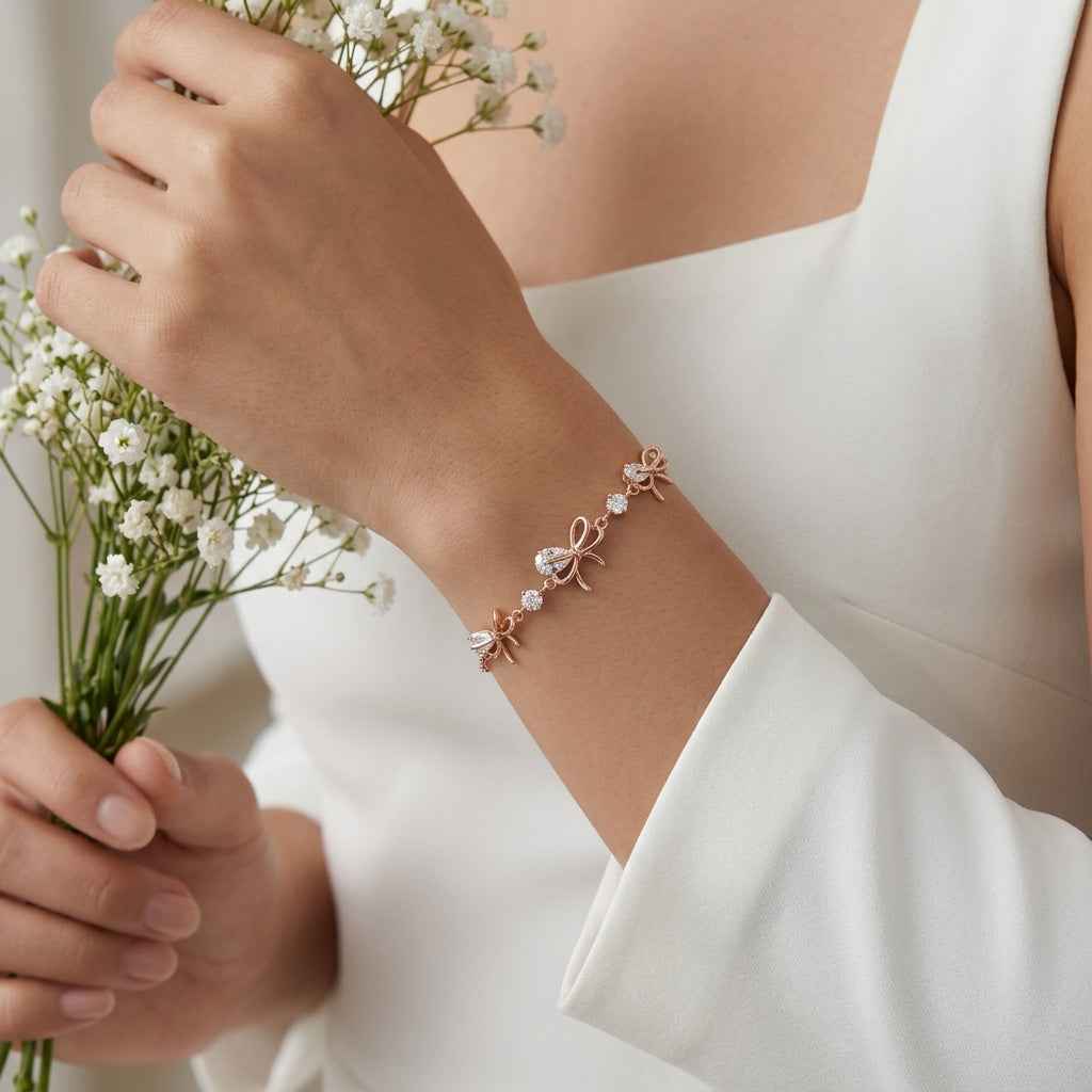 A model wearing the dainty diamond ribbon rose bracelet, illustrating its elegant drape on the wrist with white flowers.
