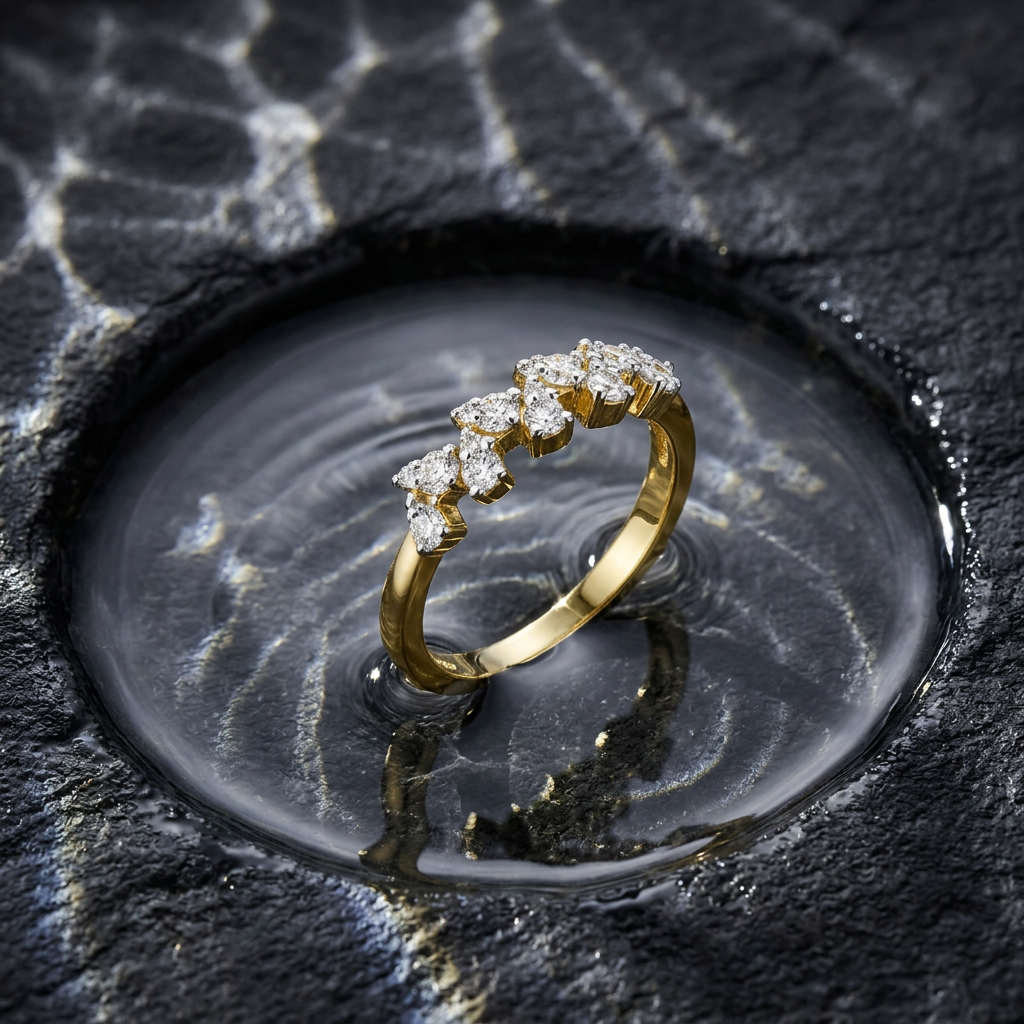 Editorial view of a sculptural yellow gold cluster ring with a jagged diamond silhouette worn on a finger.