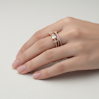 A detailed close-up showing a multi layered statement ring design featuring sculptural sweeping lines intricately set with brilliant pavé lab grown diamonds anchoring a striking step cut stone.