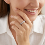 A contemporary jewelry hand stack anchoring an architectural silver chevron ring with slim silver companion bands.