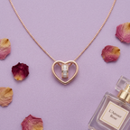 luxury rose gold heart ring necklace highlighting the polished finish.