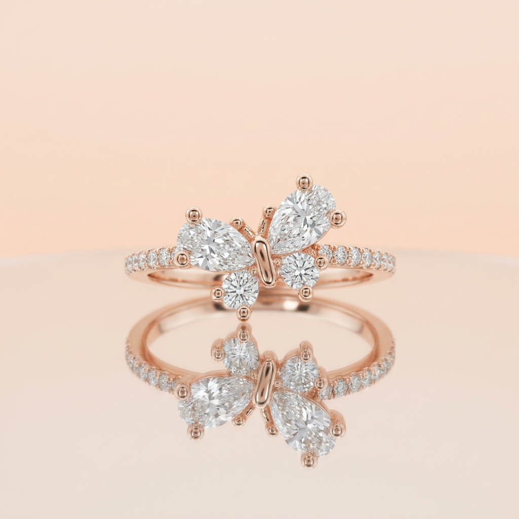 Studio product shot of a rose gold pavé band featuring a sculptural butterfly wing silhouette of cluster stones.