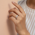 Side angle of an open wrap diamond ring in sterling silver emphasizing its fluid architectural weight.