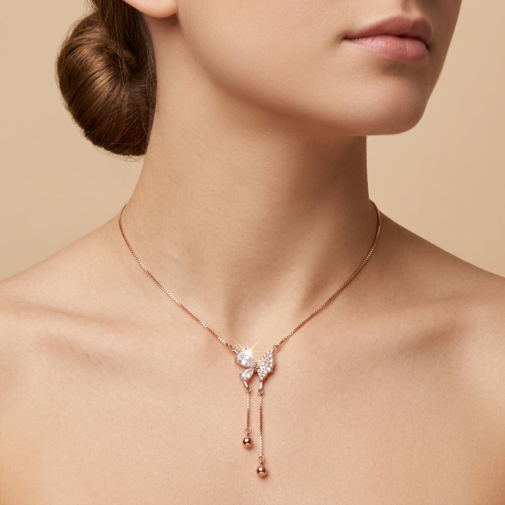 A model wearing the Roseate Papillon rose gold butterfly necklace, displaying its elegant hang and delicate drop chain details.