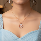 Lifestyle look showcasing an elegant rose gold celestial heart necklace accented by a shimmering planetary loop.