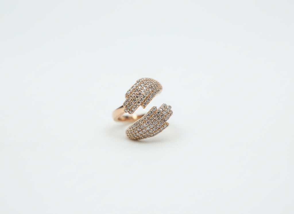 An elegant open bypass ring in warm rose gold with pavé details, presented as a meaningful anniversary gift.