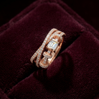 A clean studio shot showcasing a multi-layered ring design with a sculptural silhouette of fluid sweeping lines set with radiant pavé lab grown diamonds cradling a flawless central step cut stone.