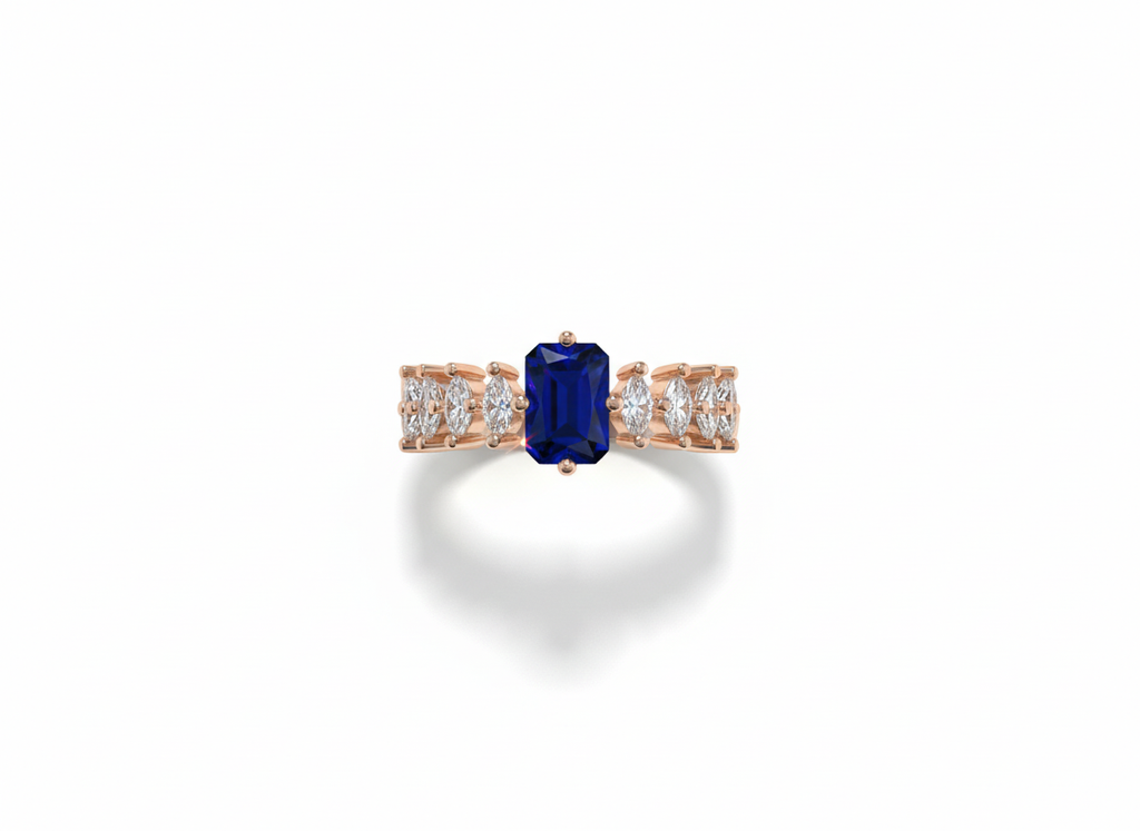 Side view displaying the tiered rose gold setting and deep hue of an indigo emerald cut gem evening ring.