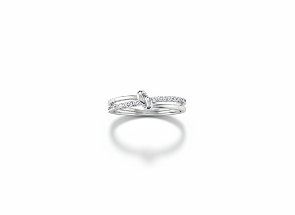 Side profile view displaying the fluid, interlocked open architecture and structural layers of a silver multi band knot ring.