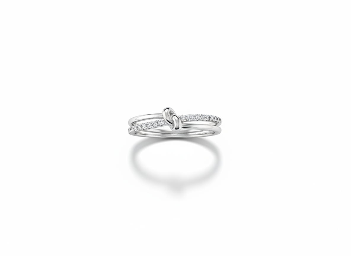 Side profile view displaying the fluid, interlocked open architecture and structural layers of a silver multi band knot ring.