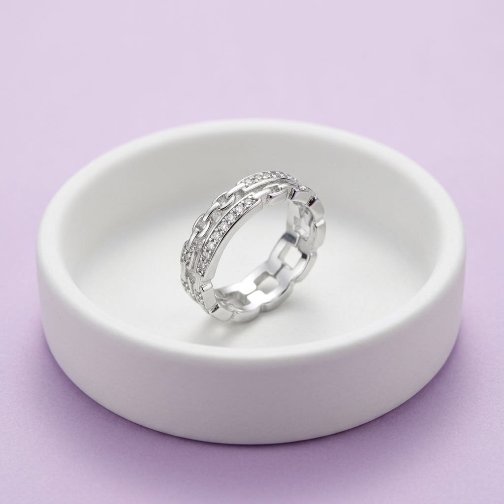 Side angle highlighting the multi-dimensional sculptural thickness and disciplined industrial style of an interlocking link ring.